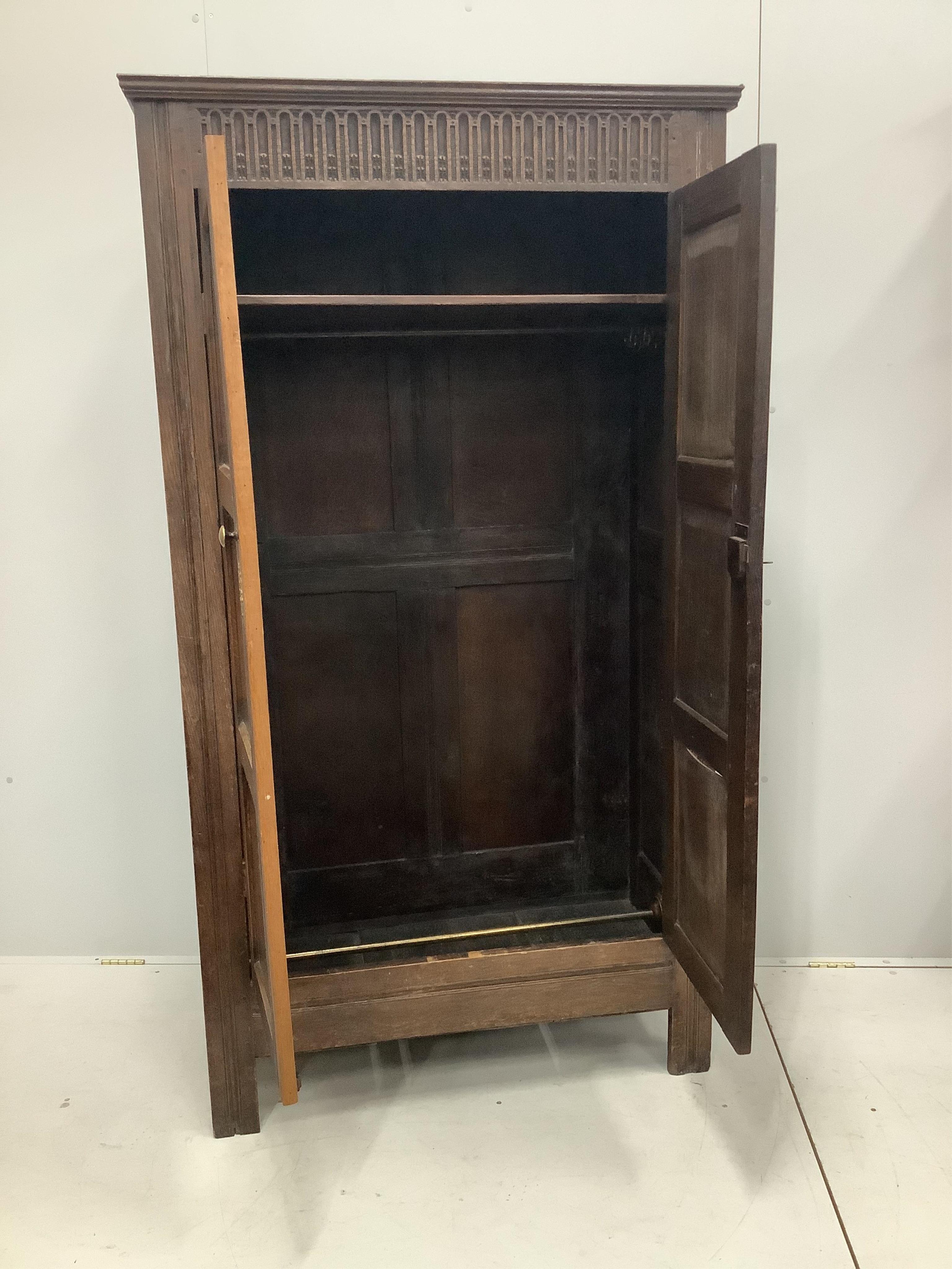 An 18th century style oak hall cupboard, width 102cm, depth 52cm, height 186cm. Condition - fair